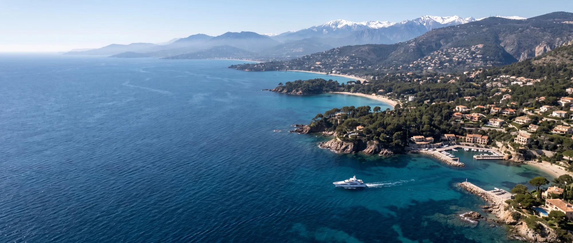The Riviera coastline from the air, headland after headland running east into the haze.